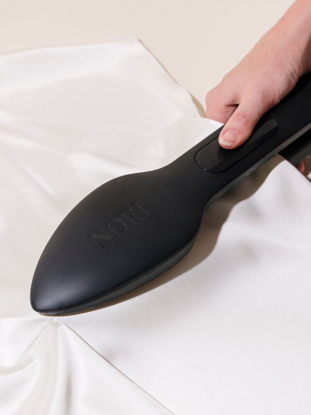 The Nori Press Lightweight Travel Handheld Iron and Steamer Black